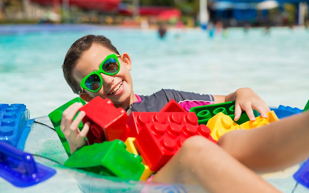 Boy enjoying wave pool with LEGO bricks at LEGOLAND Malaysia Waterpark.