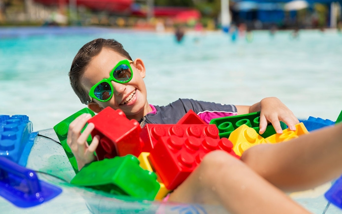 Boy enjoying wave pool with LEGO bricks at LEGOLAND Malaysia Waterpark.
