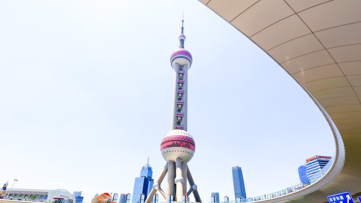 Oriental Pearl TV Tower in Shanghai, China, with surrounding cityscape.