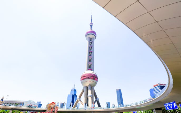 Oriental Pearl TV Tower in Shanghai, China, with surrounding cityscape.