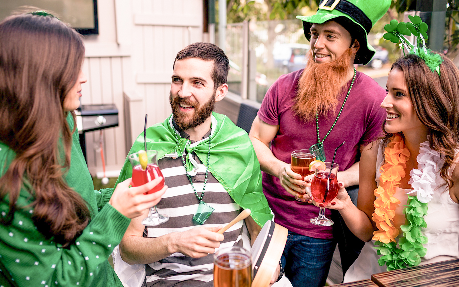 Group of happy multiracial friends dancing at sunrise beach party in summer vacation