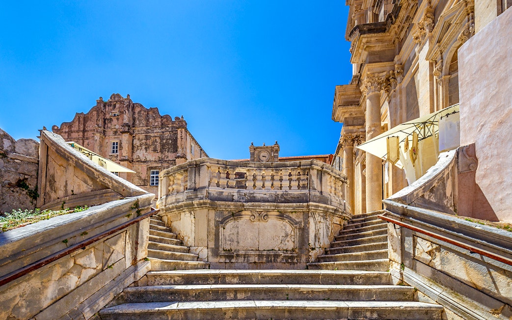Jesuit Stairs leading to historic buildings in Dubrovnik's city center.