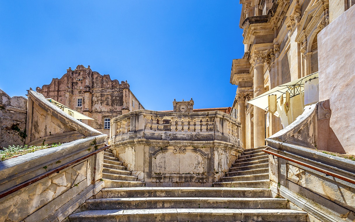 Jesuit Stairs leading to historic buildings in Dubrovnik's city center.