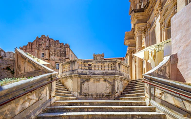 Jesuit Stairs leading to historic buildings in Dubrovnik's city center.