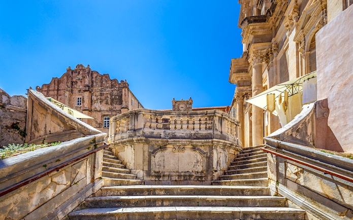 Jesuit Stairs leading to historic buildings in Dubrovnik's city center.