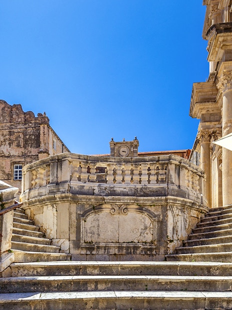 Jesuit Stairs leading to historic buildings in Dubrovnik's city center.