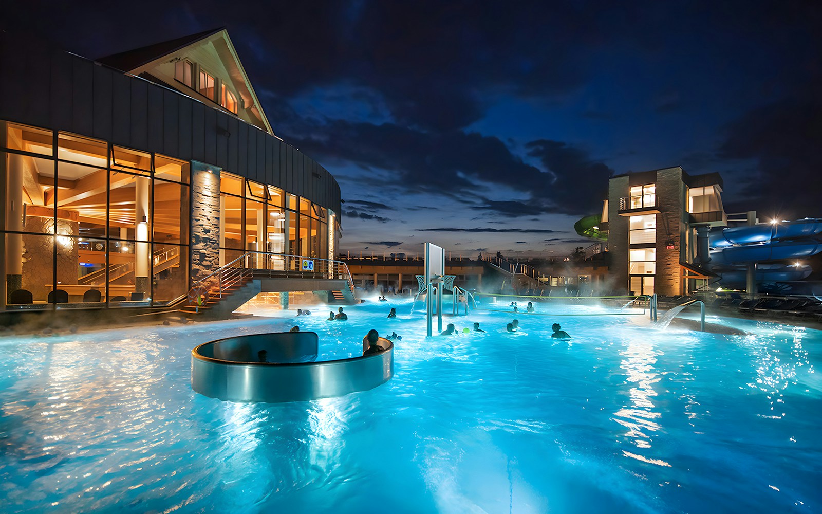 Group of tourists enjoying a full-day trip from Krakow, experiencing the thermal spa and cable car ride in Zakopane with convenient hotel transfers