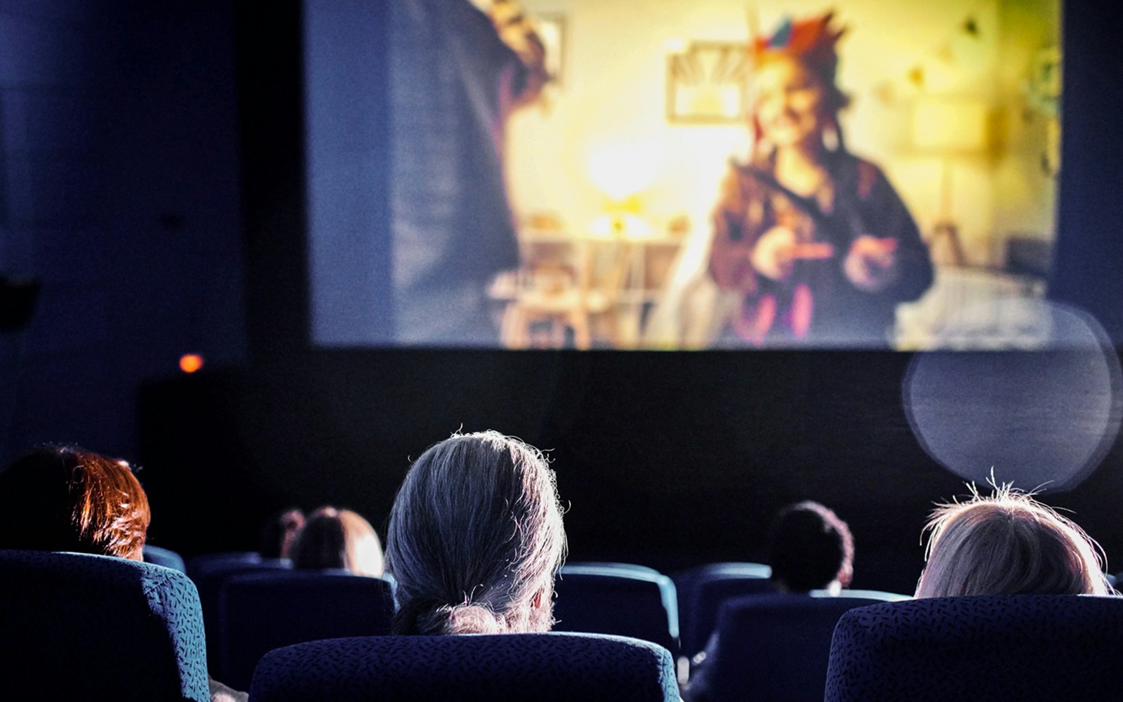 People watching a movie at ArtScience Museum Cinema.