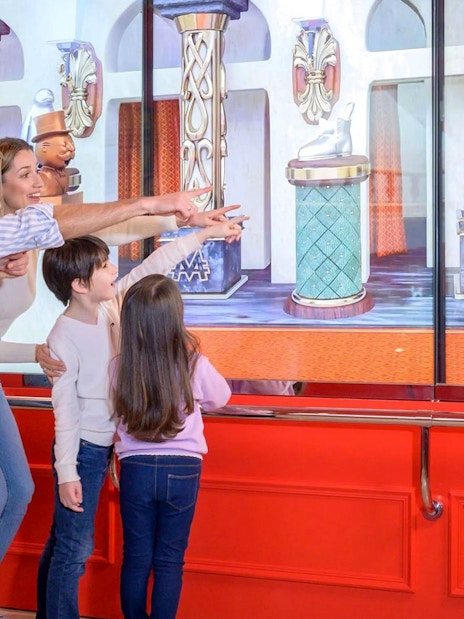 Family enjoying interactive display at Monopoly Dreams Melbourne.