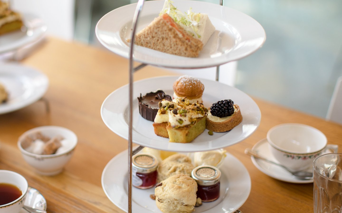 Afternoon tea with pastries and sandwiches at Cellarium Café, Westminster Abbey.