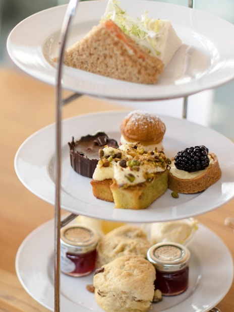 Afternoon tea with pastries and sandwiches at Cellarium Café, Westminster Abbey.