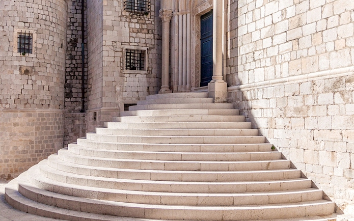 Stone steps leading to a historic building in Dubrovnik, featured in King's Landing Walking Tour.