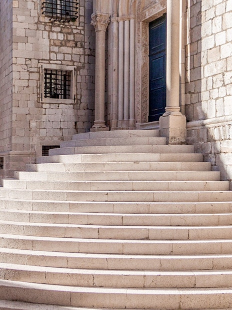 Stone steps leading to a historic building in Dubrovnik, featured in King's Landing Walking Tour.