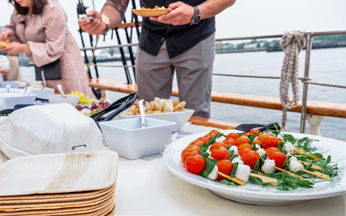 Caprese skewers and assorted dishes on Liberty Star Boston cruise.