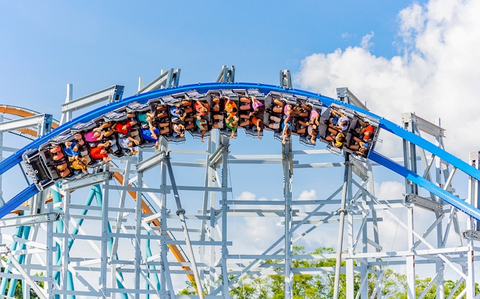 Roller coaster loop with riders at Six Flags Over Georgia.