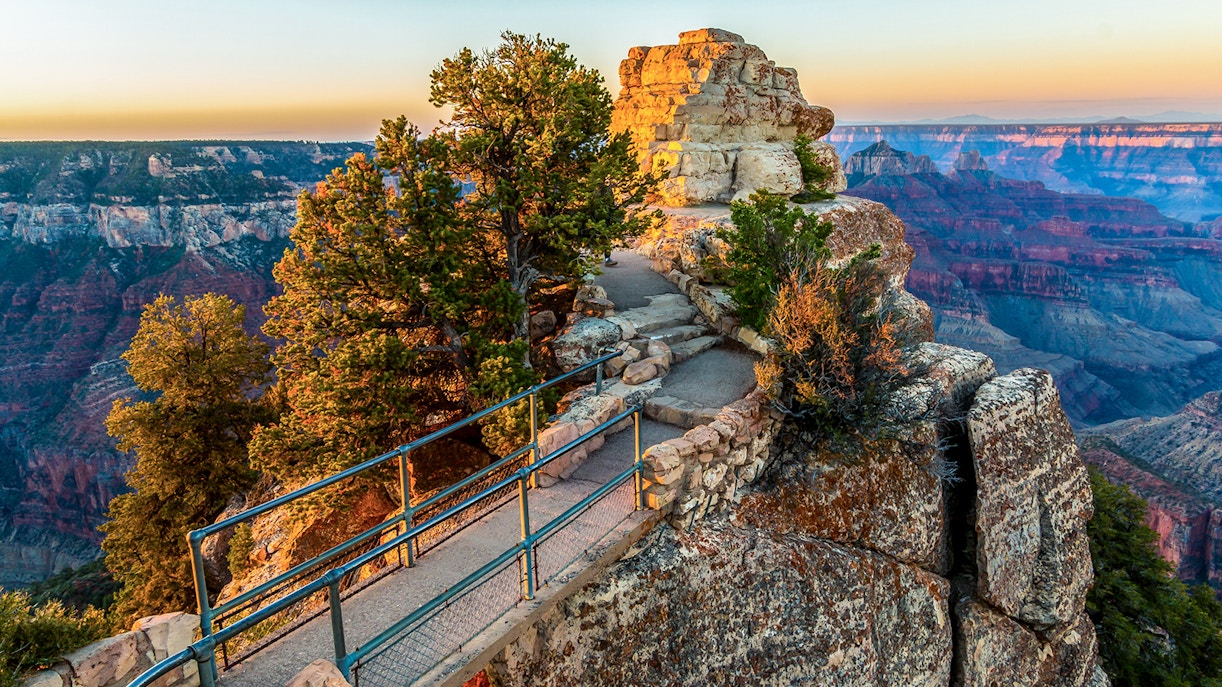 Bridge to Bright Angel Point, Grand Canyon, Arizona, with canyon views at sunrise.