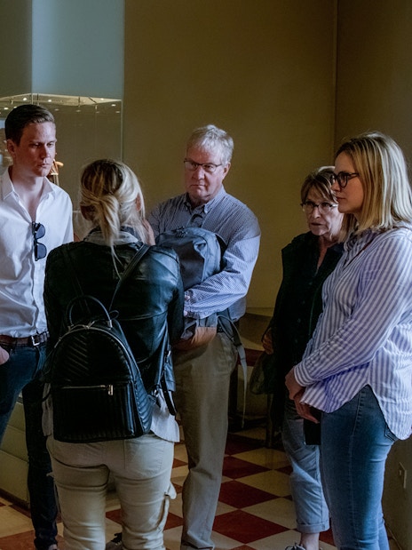 Tour guide speaking to a group in the Musical Instruments room, Accademia Gallery.