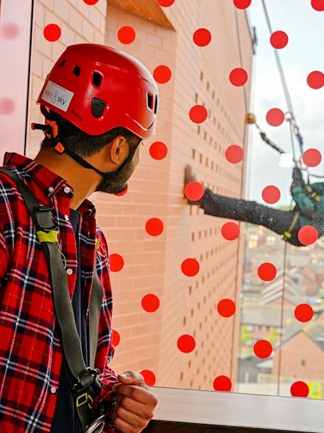 Guest observing abseiler at Anfield Abseil Experience, Liverpool.