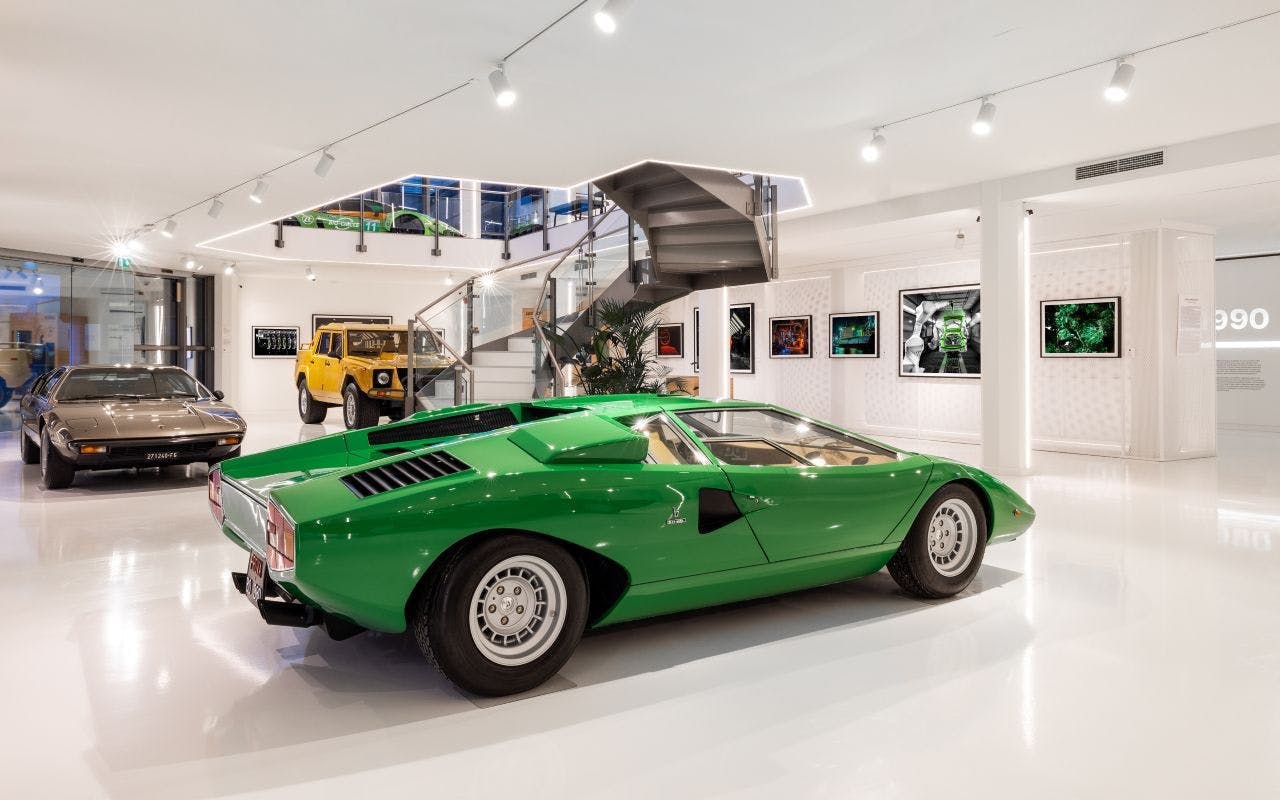 Green Lamborghini Countach at Lamborghini Museum exhibit.
