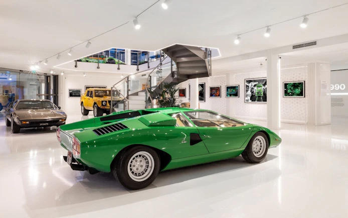 Green Lamborghini Countach at Lamborghini Museum exhibit.