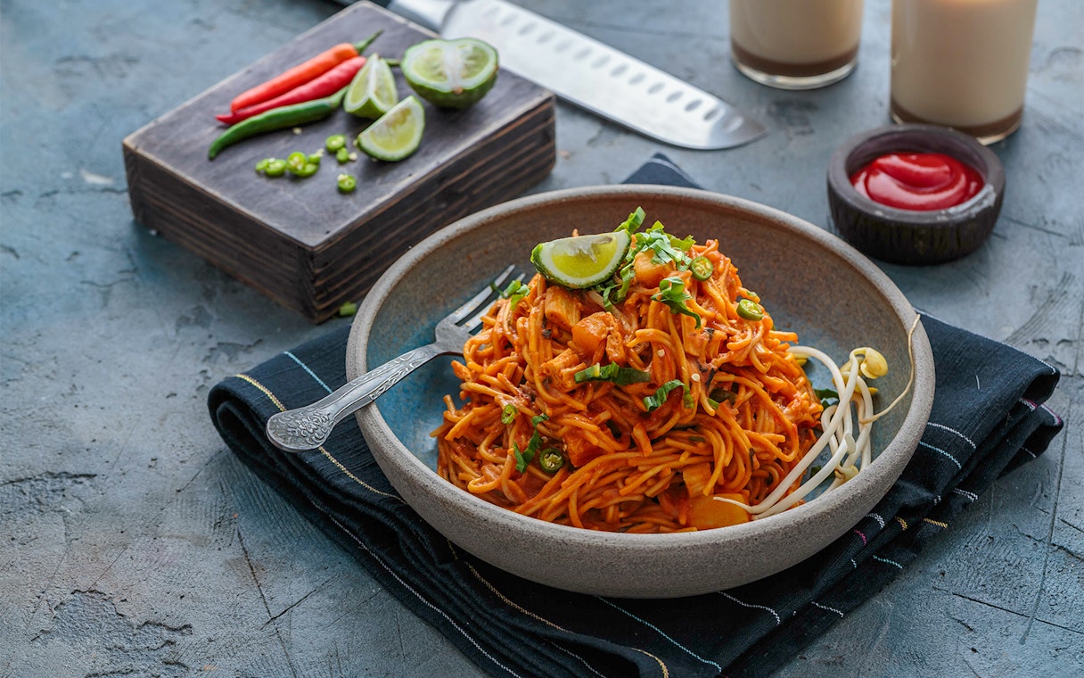 Noodles with lime and chili on Sentosa Island dining table.