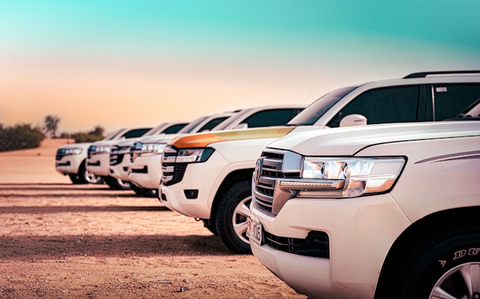4x4 vehicles lined up for Abu Dhabi desert safari.