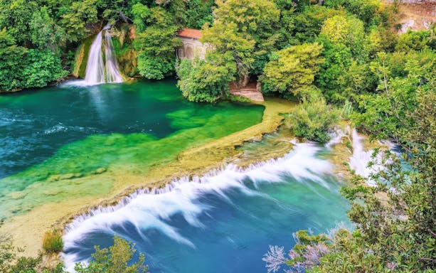 Waterfalls and lush greenery at Krka National Park, Croatia.