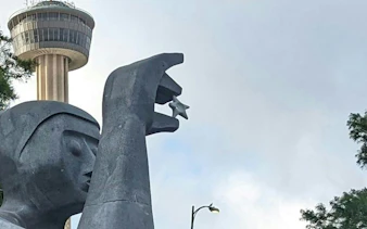 Tower of the Americas and sculpture in San Antonio, part of the self-guided city exploration game.