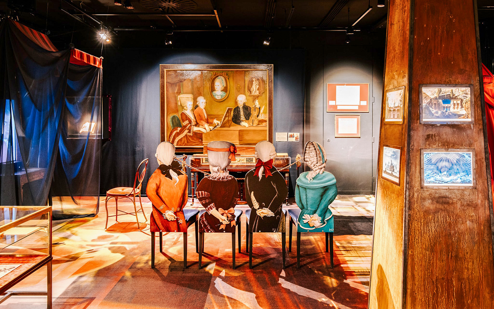 Guests exploring an exhibit with historical figures at Haus der Musik, Vienna.