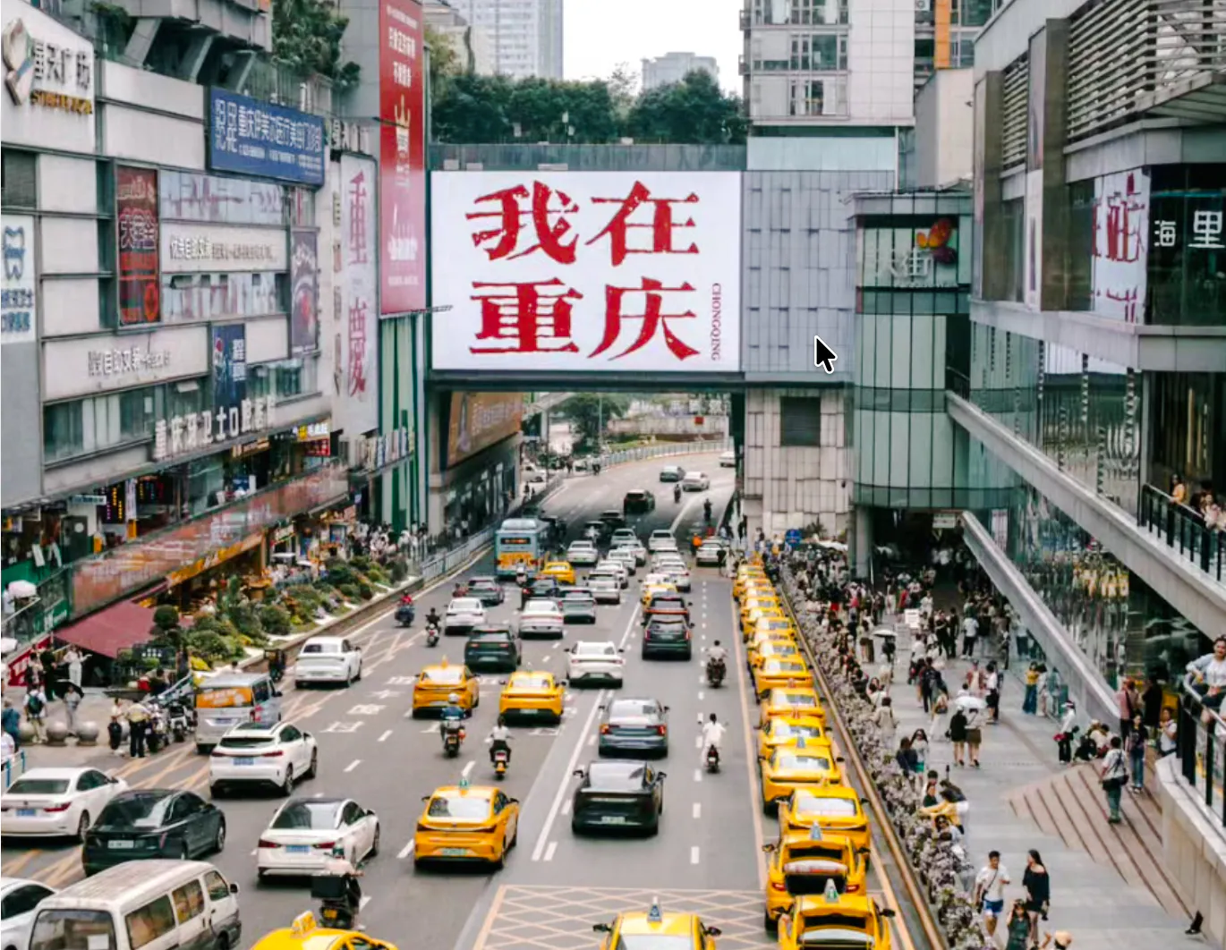 Busy street scene in Chongqing with taxis, pedestrians, and a large sign in Chinese characters.