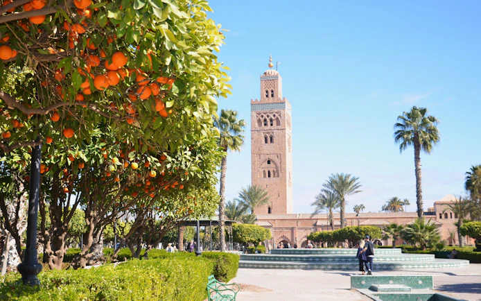 Koutoubia Mosque with orange trees in Marrakech, Morocco.