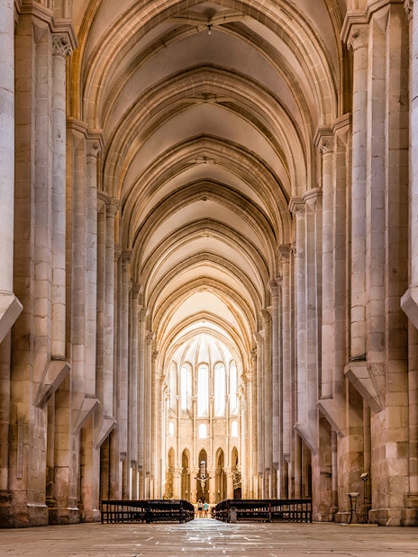 Alcobaça Monastery interior with vaulted arches and stone columns, Portugal.
