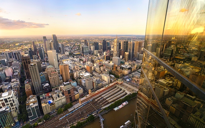 Melbourne cityscape view from Eureka Tower Skydeck, overlooking Yarra River and urban skyline.