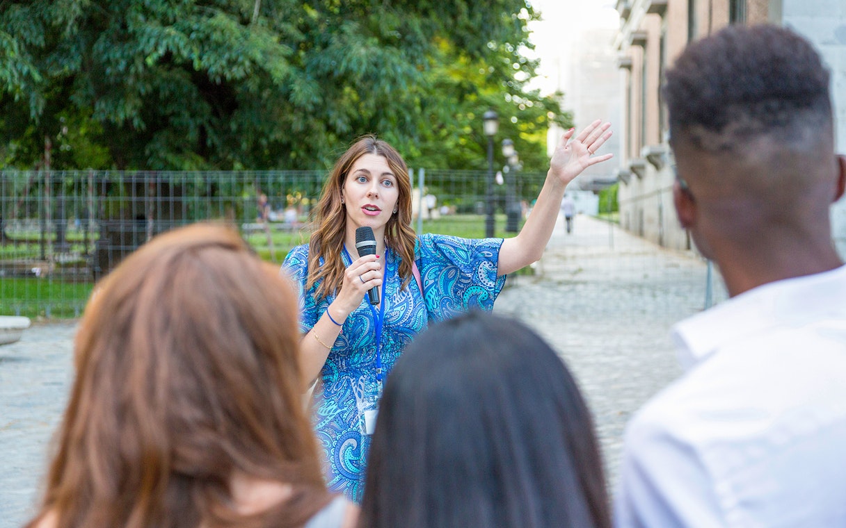 Tour guide leading a group on the Tower Bridge & Westminster Walking Tour.