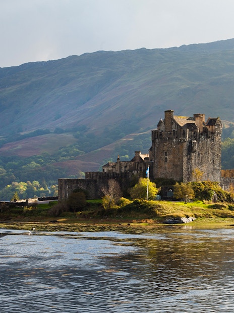 Eilean Donan Castle on a small island with a stone bridge, Isle of Skye, Scotland.