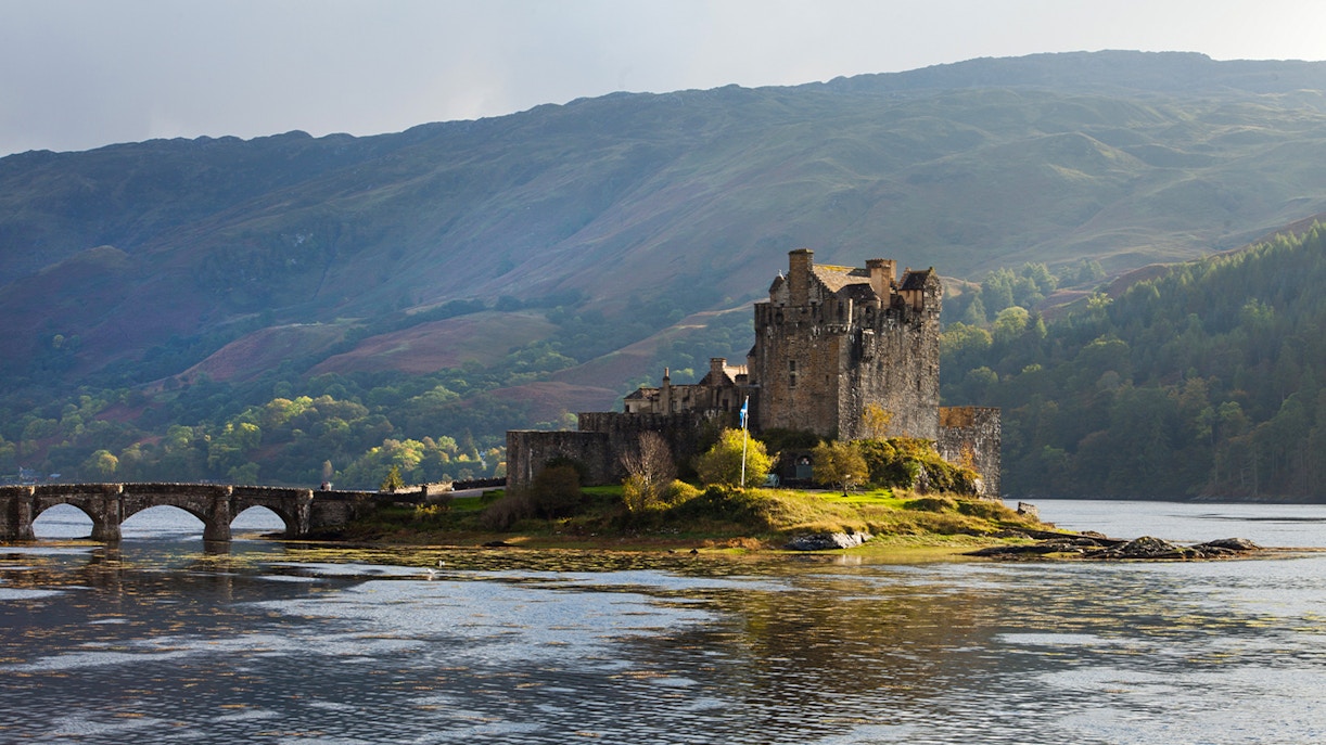 Eilean Donan Castle on a small island with a stone bridge, Isle of Skye, Scotland.