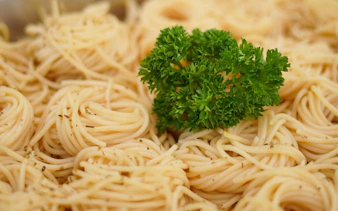 Spaghetti dish with parsley garnish served on Riverside Carnival Cruise in Bangkok.