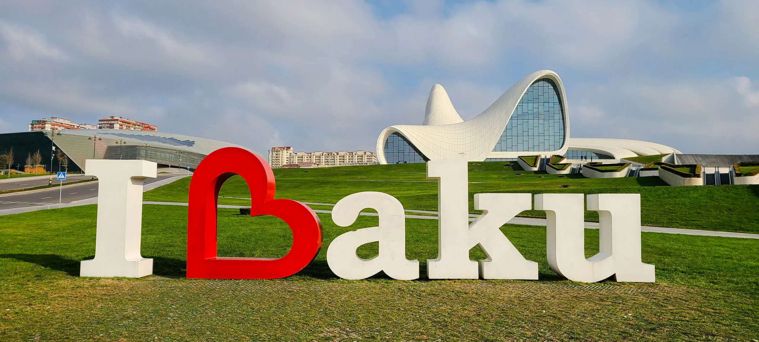 Heydar Aliyev Center with Baku sign in foreground, Baku City Tour.