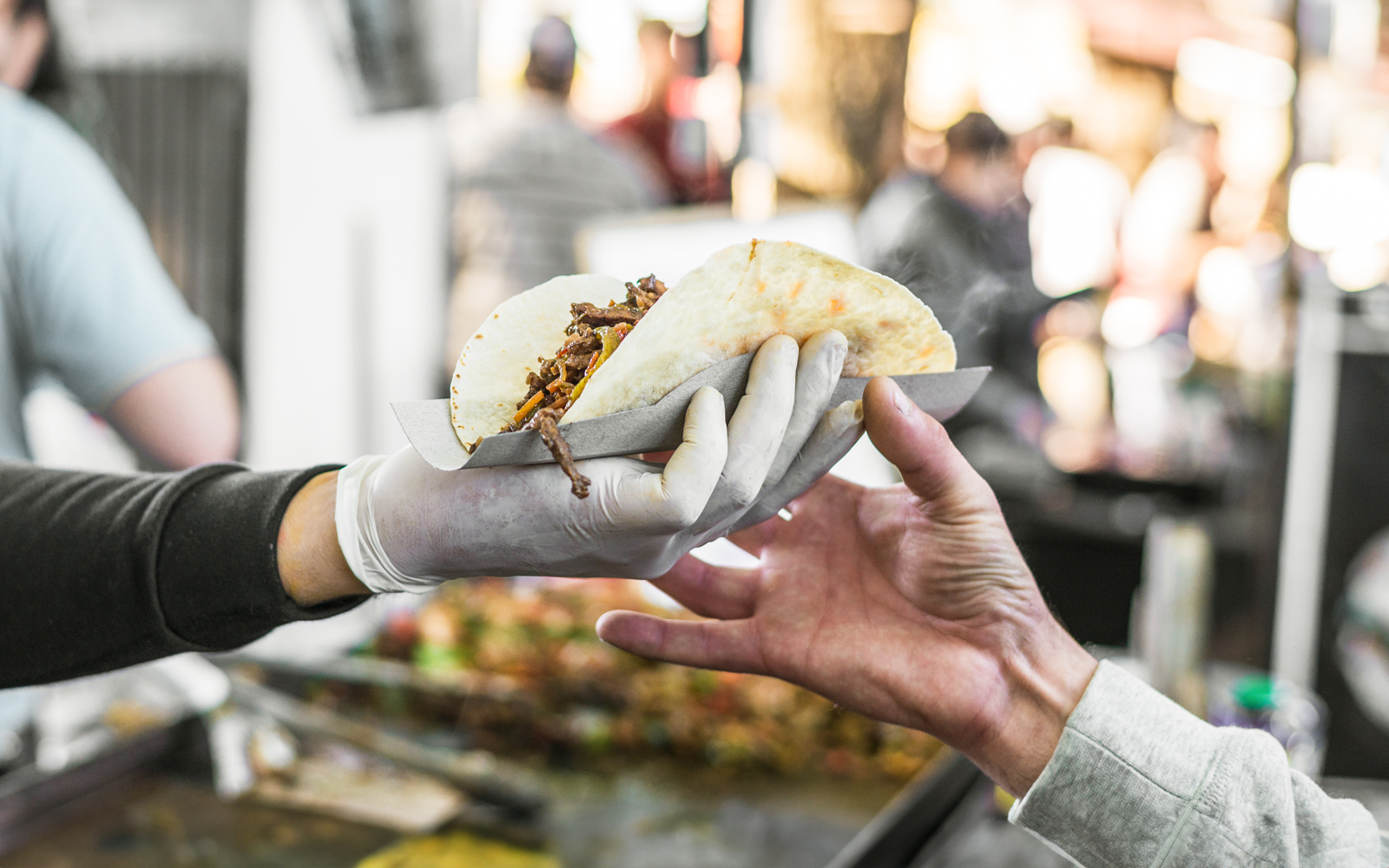 Visitors exploring marine life exhibits at Blue Planet Aquarium.