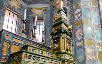 Medici Chapels ornate altar with intricate marble and woodwork details, Florence, Italy.