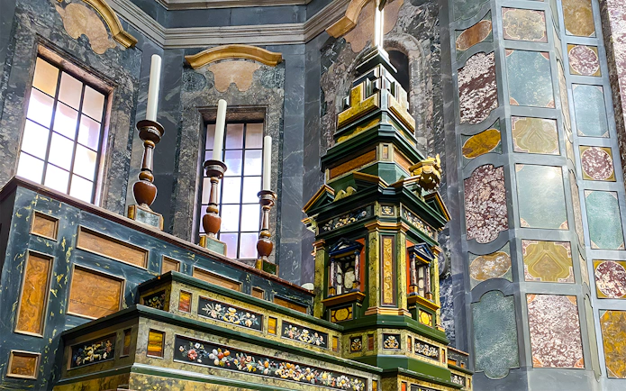 Medici Chapels ornate altar with intricate marble and woodwork details, Florence, Italy.