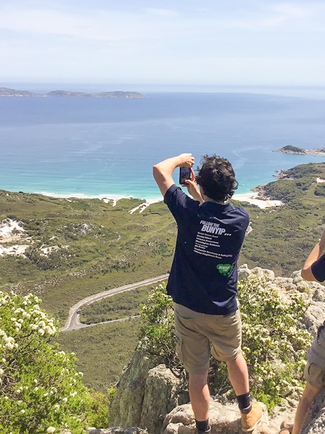 Tourists photographing coastal view at Wilsons Promontory, Australia.