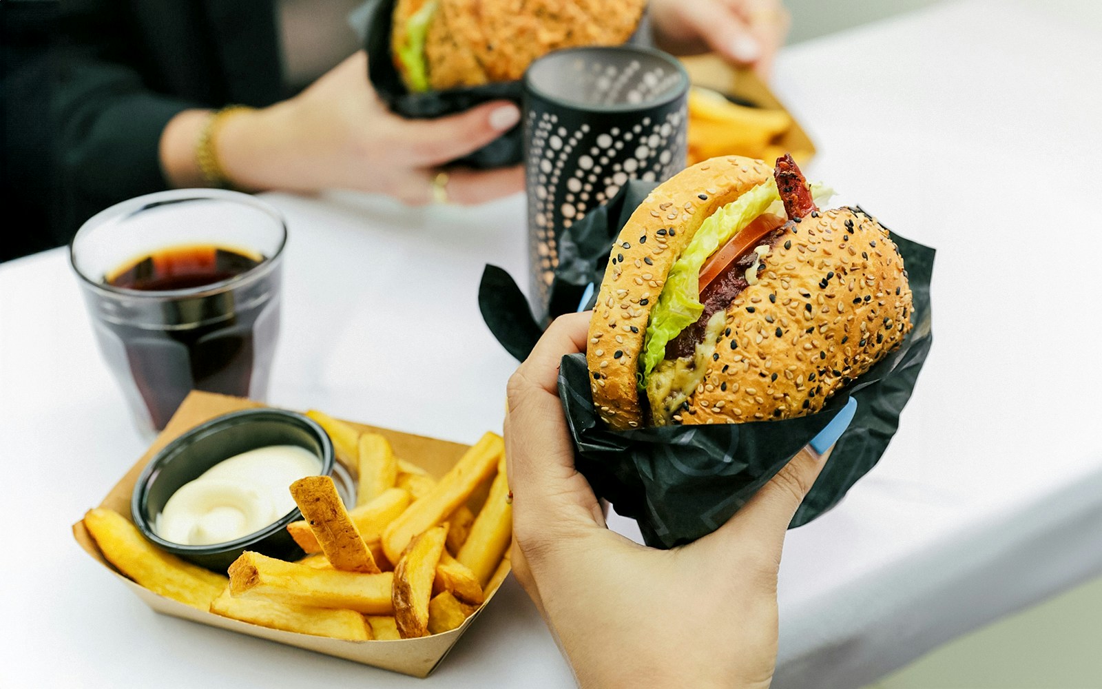 Burger and fries served on Amsterdam canal cruise.
