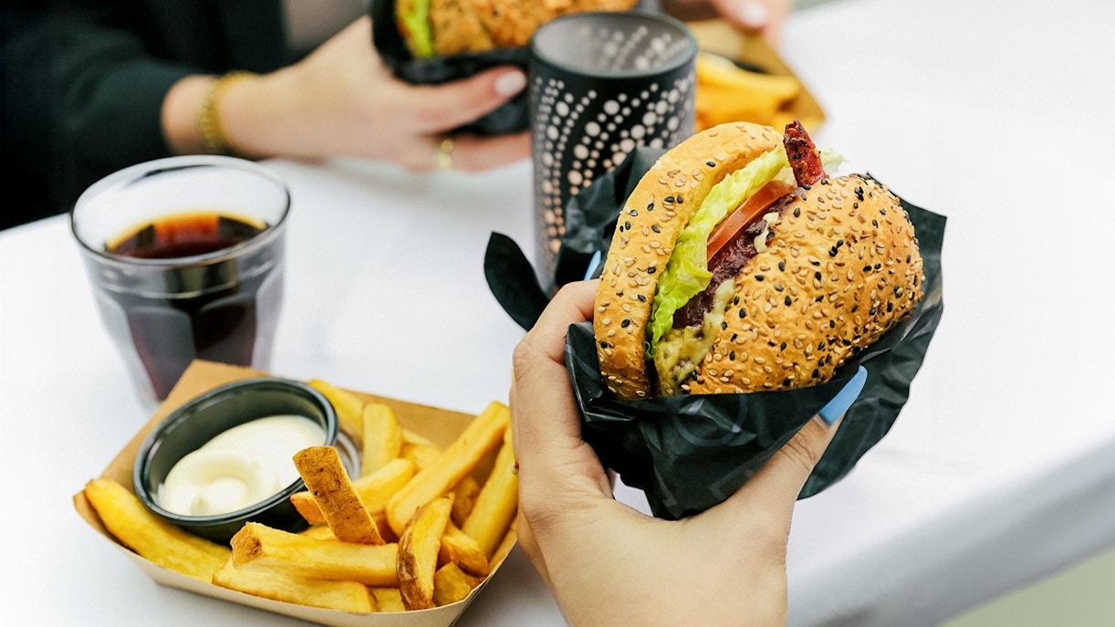 Burger and fries served on Amsterdam canal cruise.