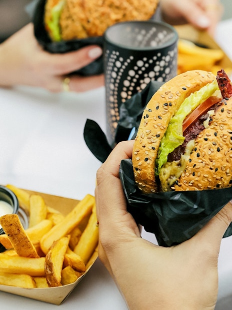 Burger and fries served on Amsterdam canal cruise.