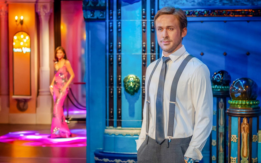 Wax figure exhibit at Madame Tussauds, Budapest featuring a man in formal attire.