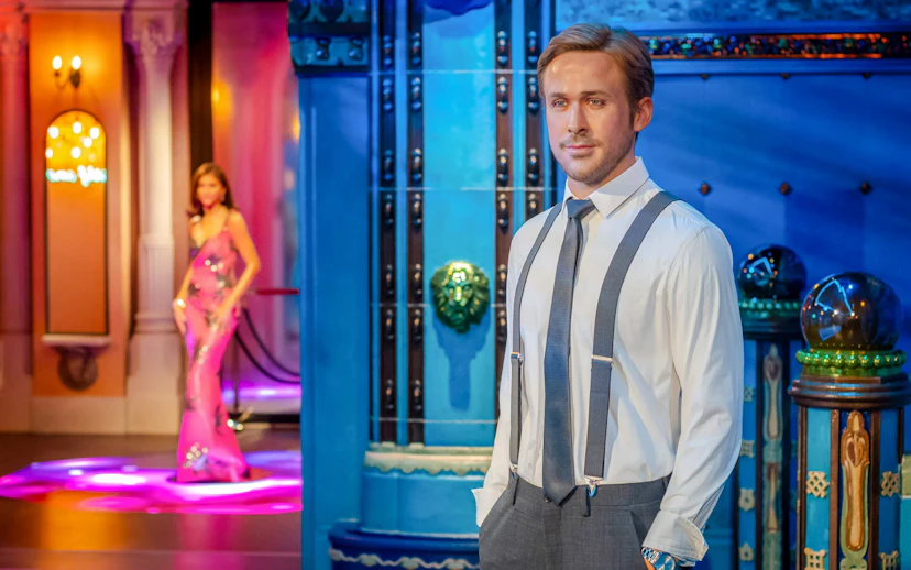 Wax figure exhibit at Madame Tussauds, Budapest featuring a man in formal attire.