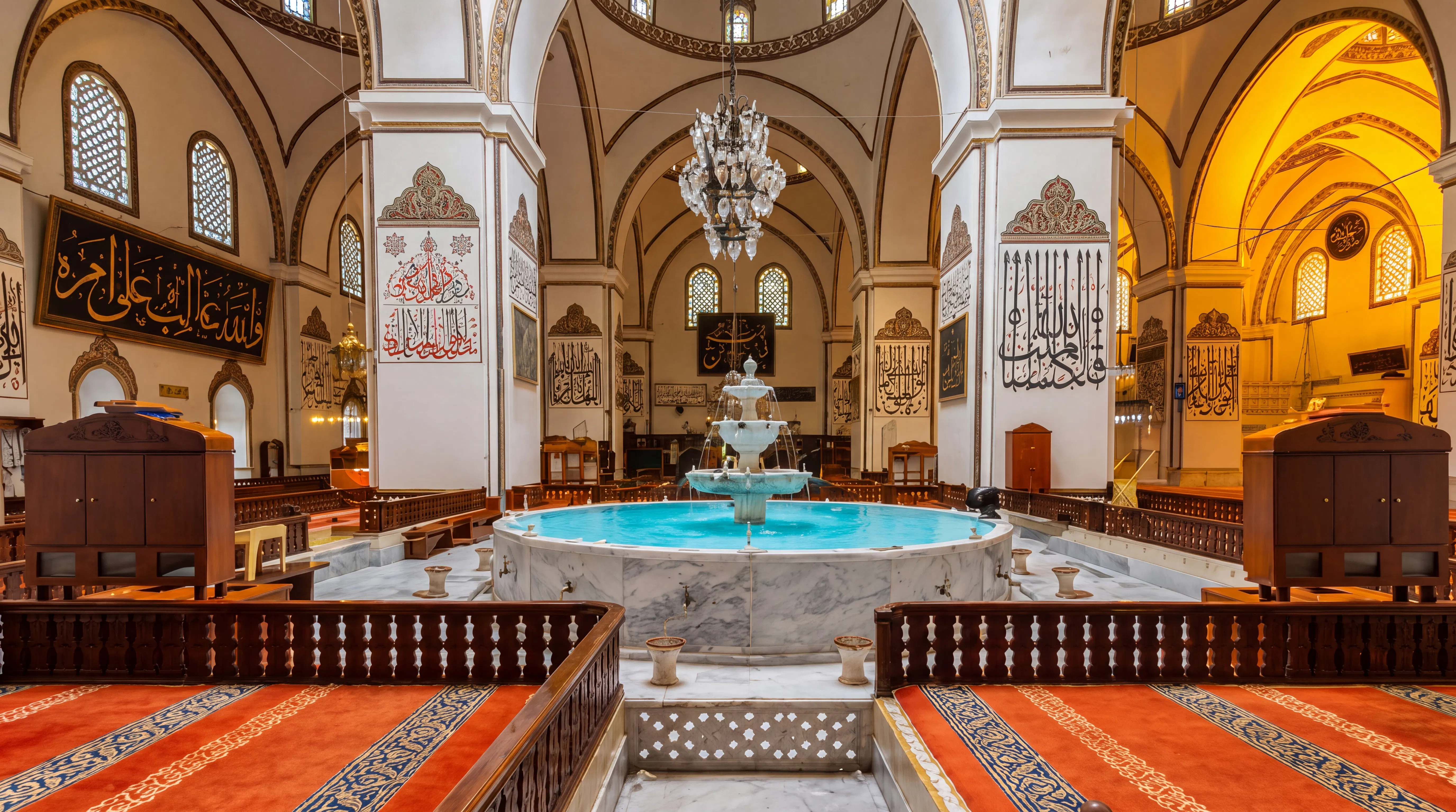 Bursa Grand Mosque interior with central fountain and ornate calligraphy, Istanbul tour.