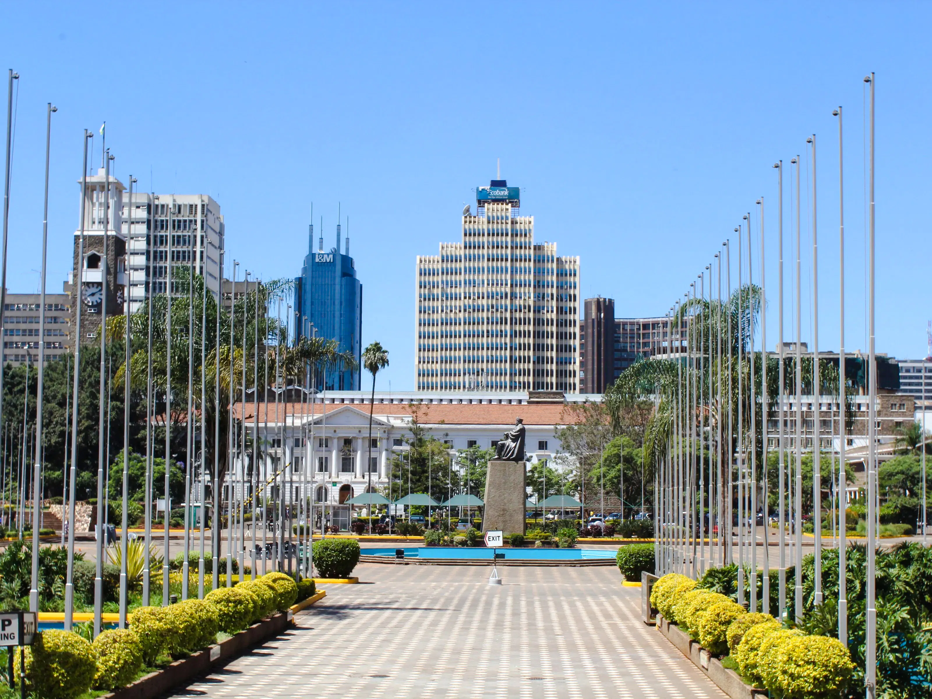 Nairobi cityscape with modern buildings and a statue, near Carnivore Restaurant Experience.