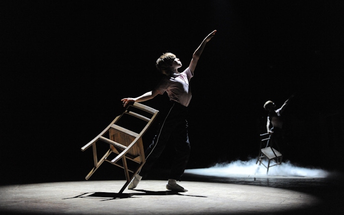 Performer dancing with a chair in Billy Elliot the Musical, West End.